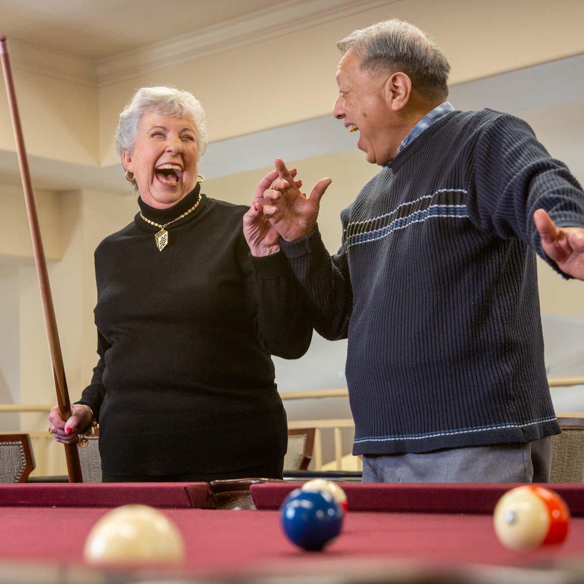 Residents playing billiards at Stoneybrook Lodge